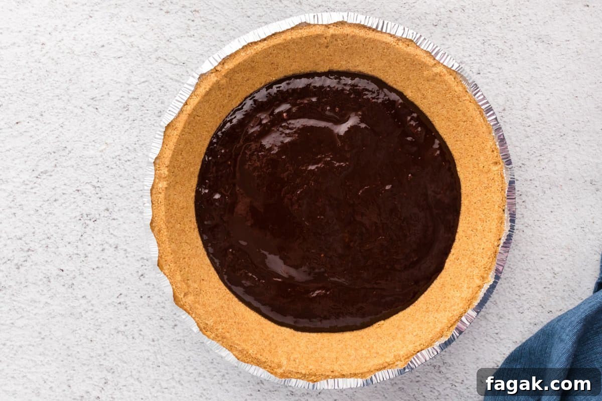 graham cracker pie crust spread with ganache.
