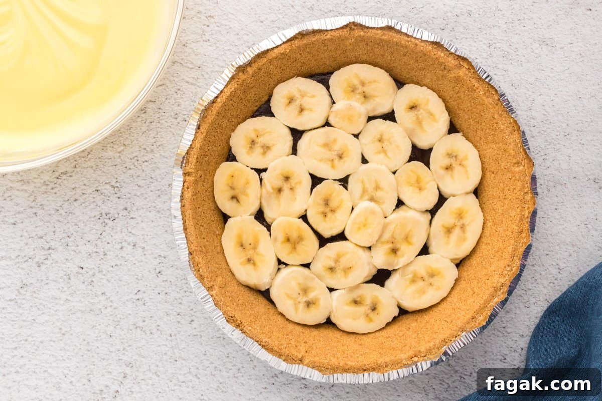 graham cracker crust filled with ganache and banana slices.