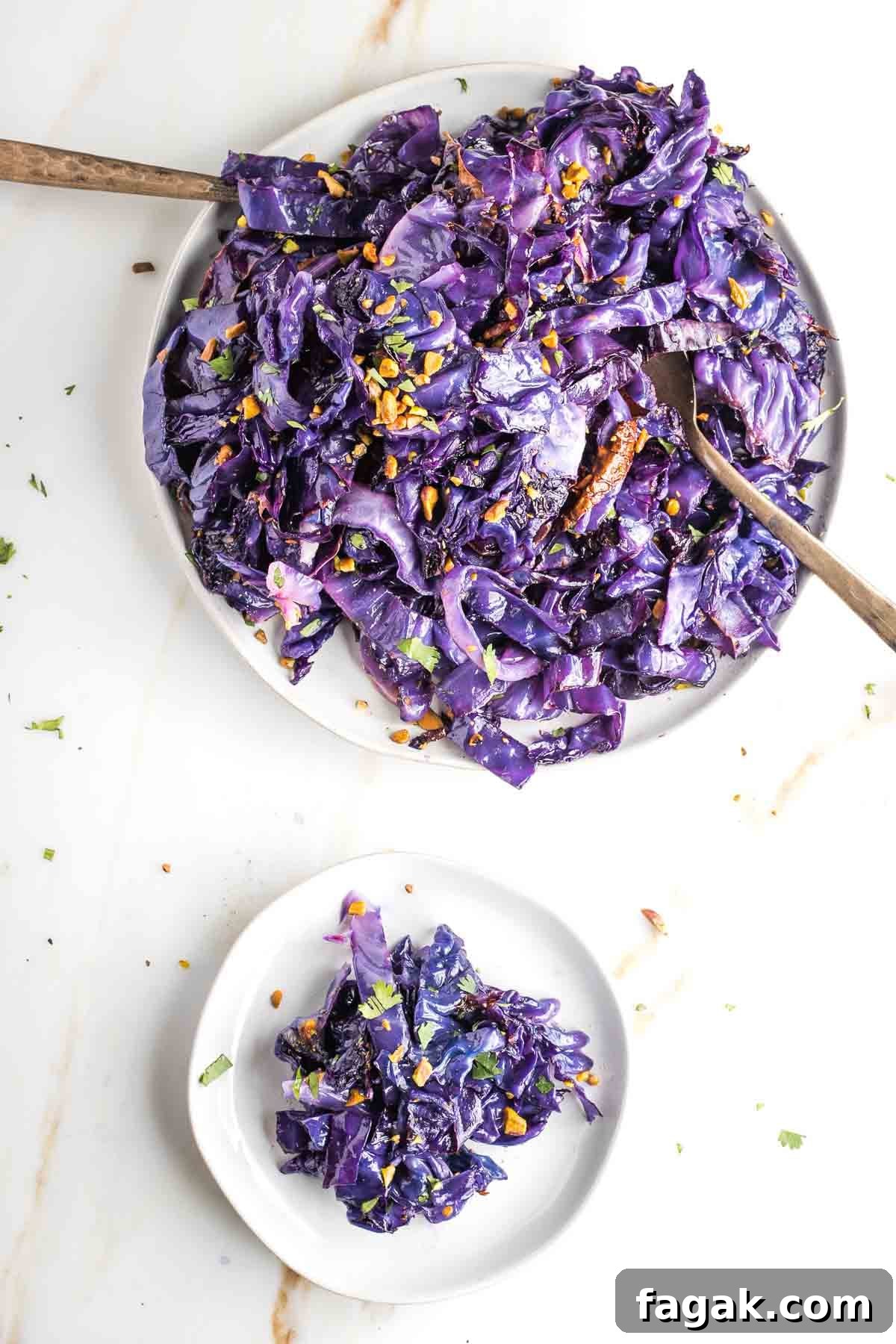 Crispy Oven-Roasted Red Cabbage with Balsamic Glaze 2 Bright purple roasted cabbage strips topped with crushed pistachios.