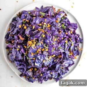 Crispy Oven-Roasted Red Cabbage with Balsamic Glaze 13 Strips of roasted red cabbage in a beautiful purple hue, sprinkled with pistachios.