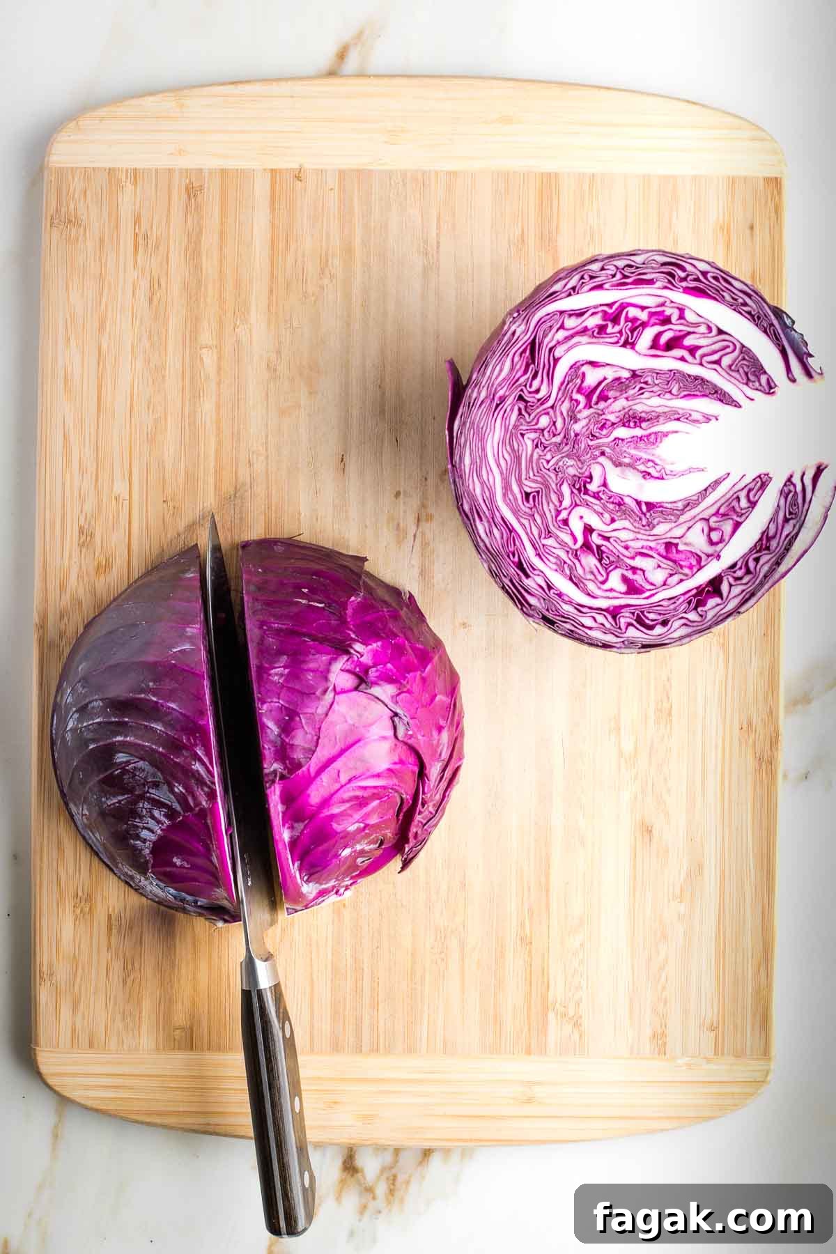 Crispy Oven-Roasted Red Cabbage with Balsamic Glaze 5 Cutting through one half of a red cabbage.