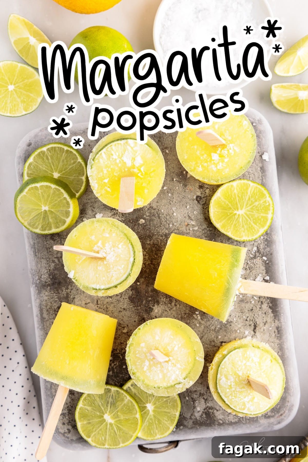 Margarita Popsicles on a serving tray with some standing up and some laying down with text label.