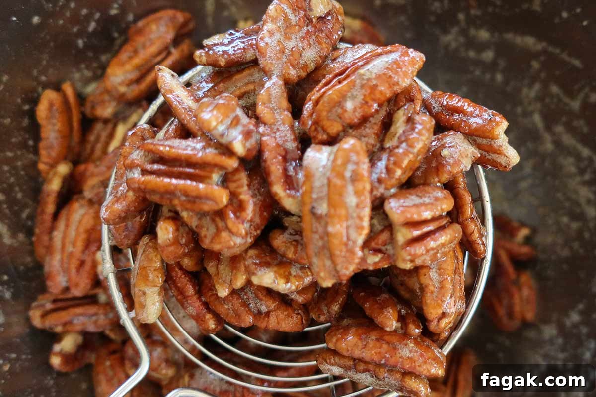 Sweet and salty maple-glazed pecans with brown sugar, shown up close