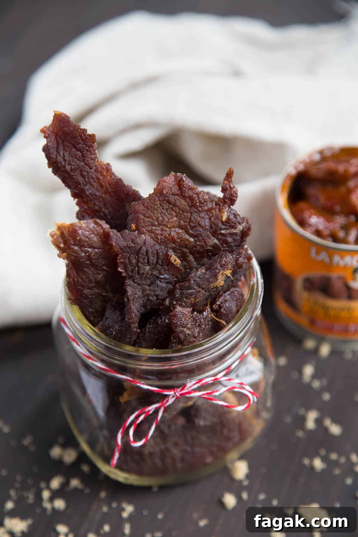 sweet and spicy beef jerky in a glass jar.