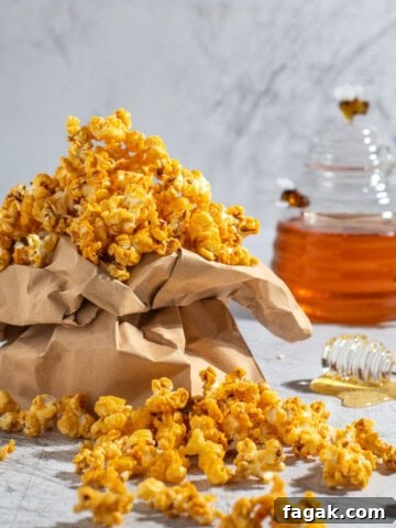 Honey popcorn in a brown paper bag.