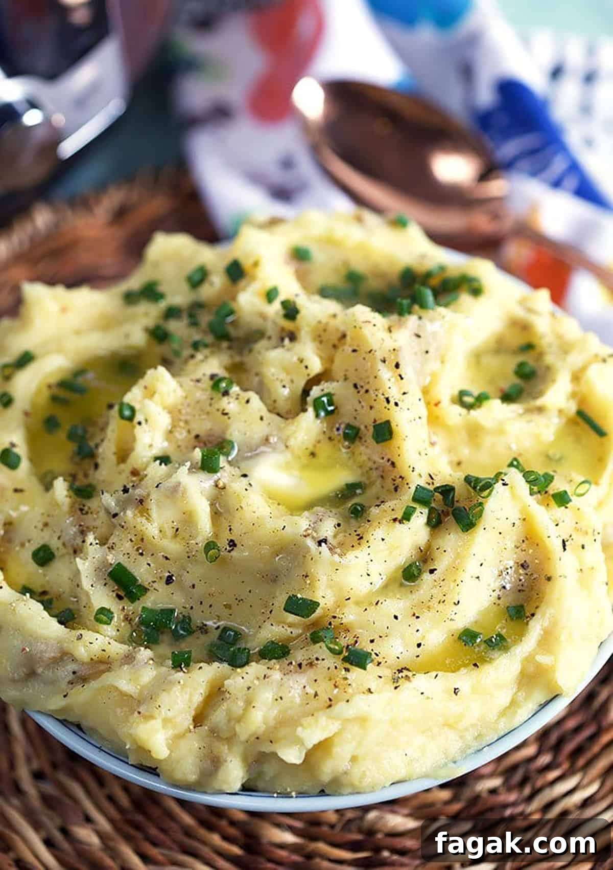 Mashed potatoes in a bowl with an Instant Pot in the background.