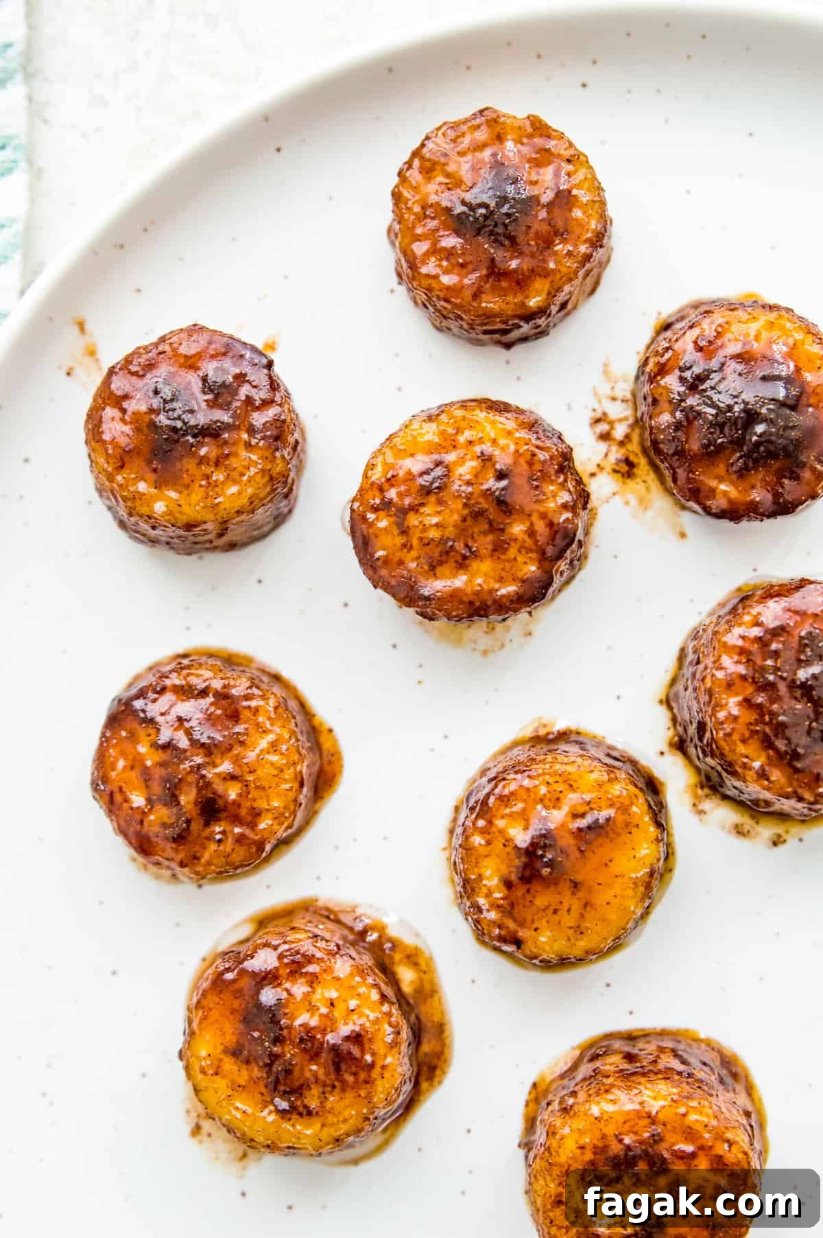 Caramelized Cinnamon Bananas in the Air Fryer 2 Caramelized banana slices on a plate.