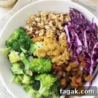 A colorful, healthy and oh so crunchy broccoli quinoa salad! With a creamy dressing and juicy golden raisins, this make-ahead dish is sure to please!
