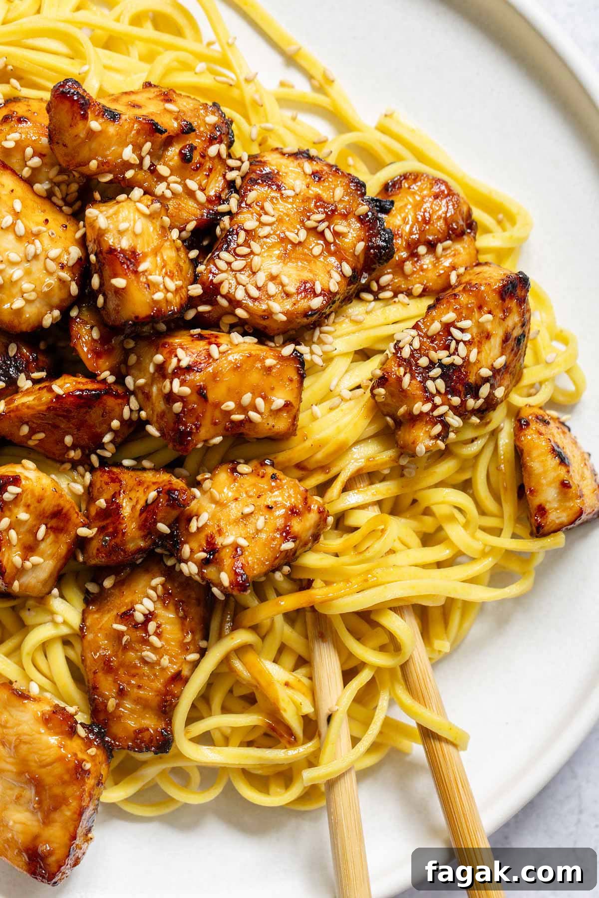 Air fryer hoisin chicken served over noodles
