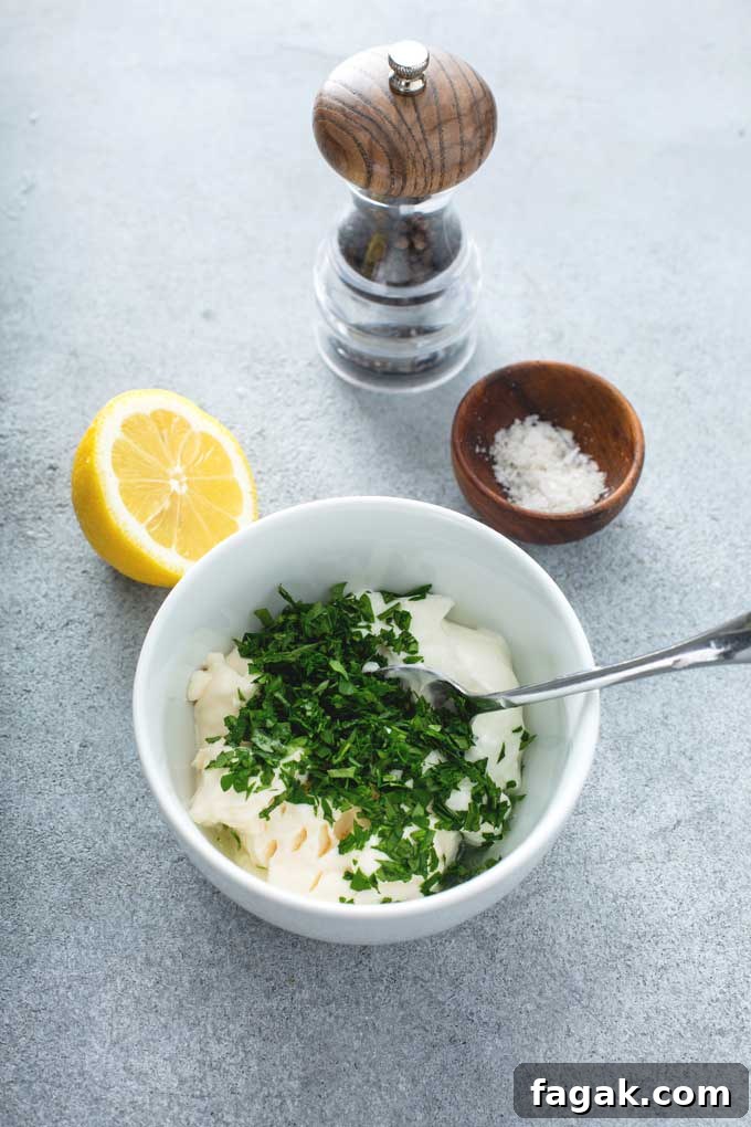 Dipping sauce ingredients getting combined in a white bowl.
