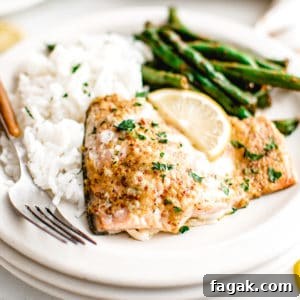 Salmon, green beans and rice on a plate.