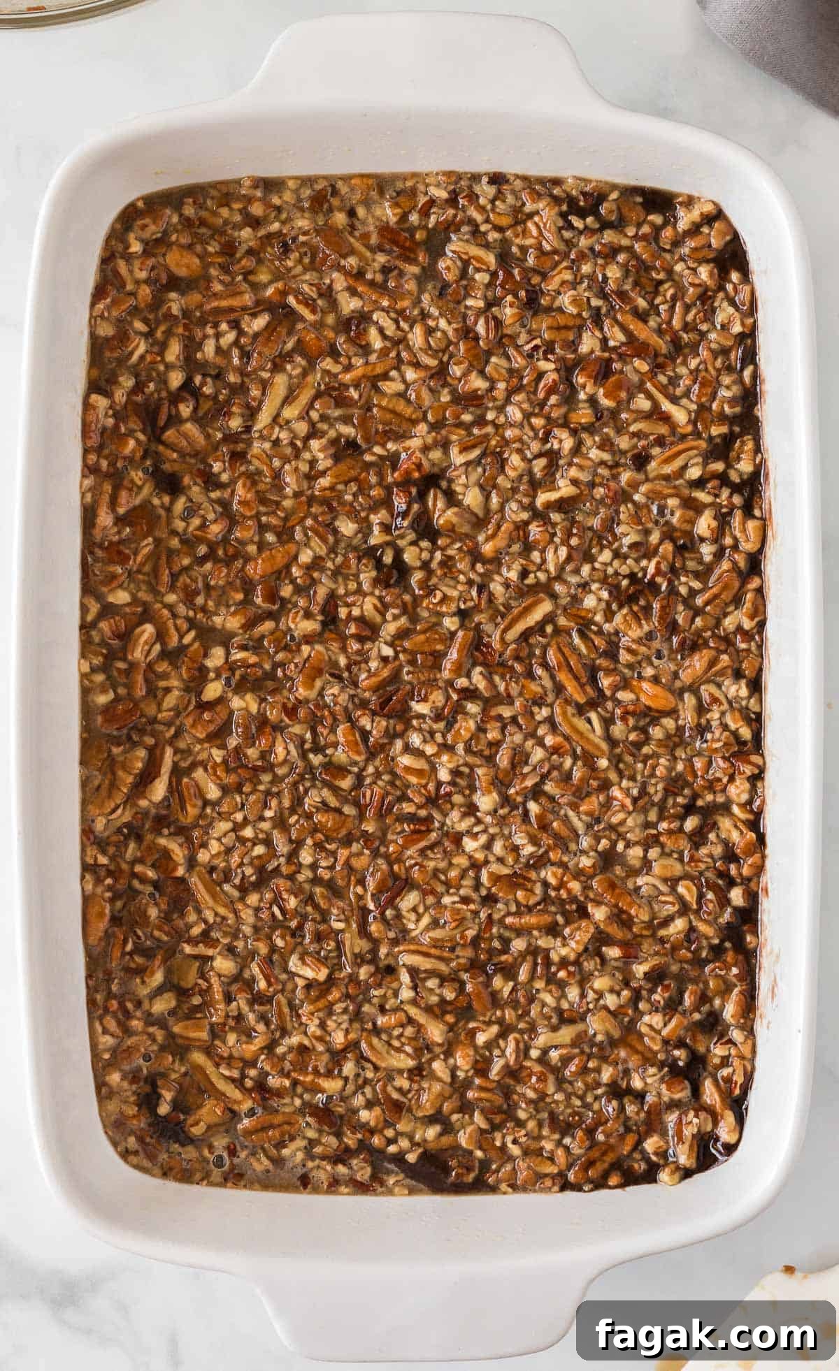 pecan pie layer poured over the brownies