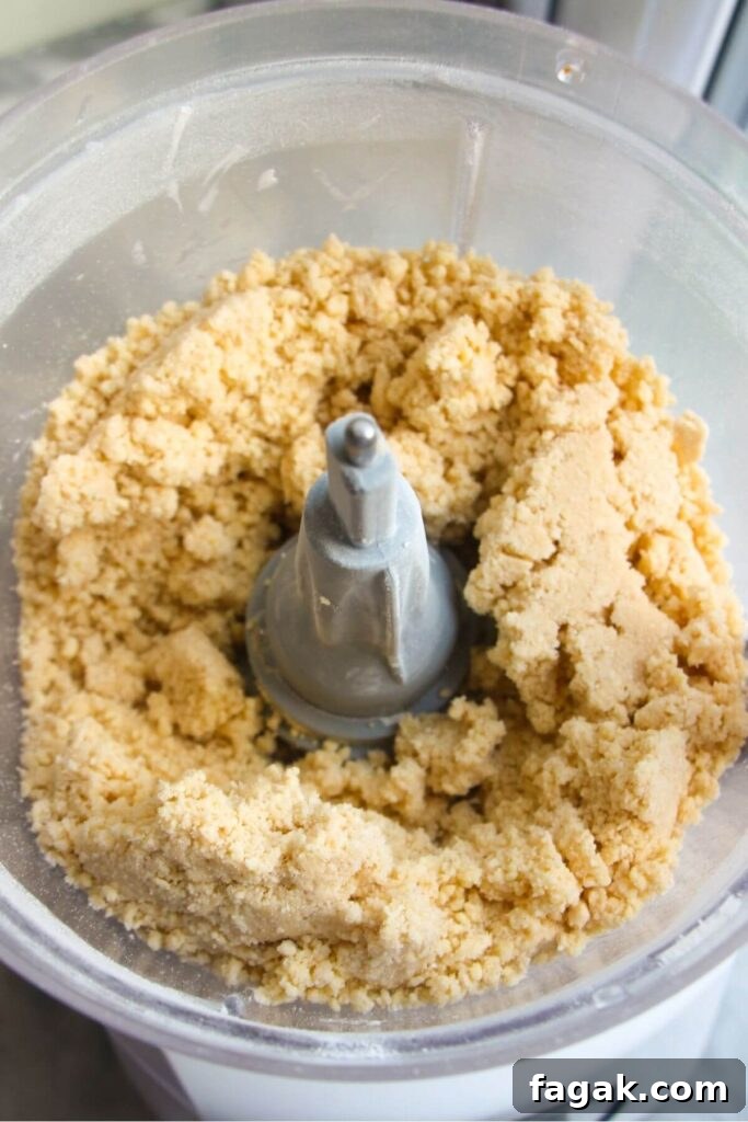 Pastry blitzed in the bowl of a food processor.