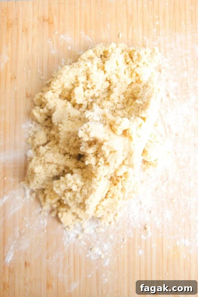 Blitzed pastry laid out on a wooden board.