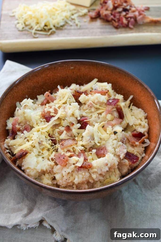 Smoked Gouda & Bacon Caauliflower Mash Recipe 3 Smoked Gouda and Bacon Cauliflower Mash in brown rustic bowl close up view