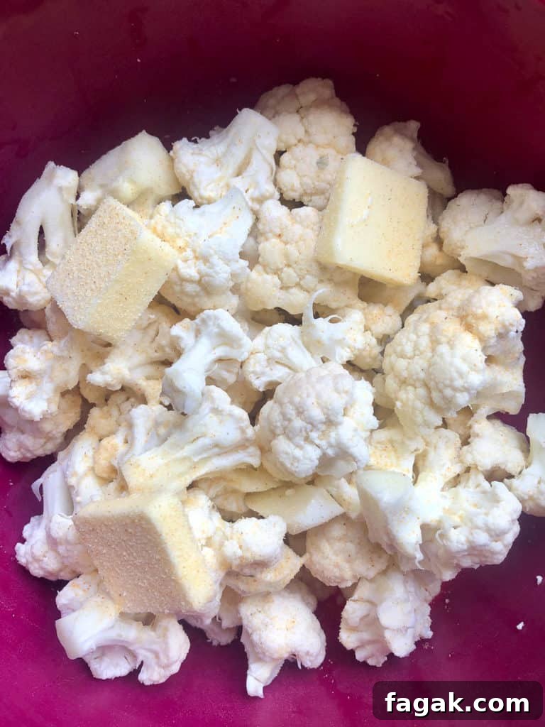 Smoked Gouda & Bacon Caauliflower Mash Recipe 4 Cauliflower and butter in bowl ready to be cooked overhead shot