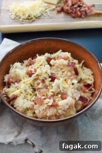Smoked Gouda & Bacon Caauliflower Mash Recipe 8 Smoked Gouda and Bacon Cauliflower Mash in brown rustic bowl close up view