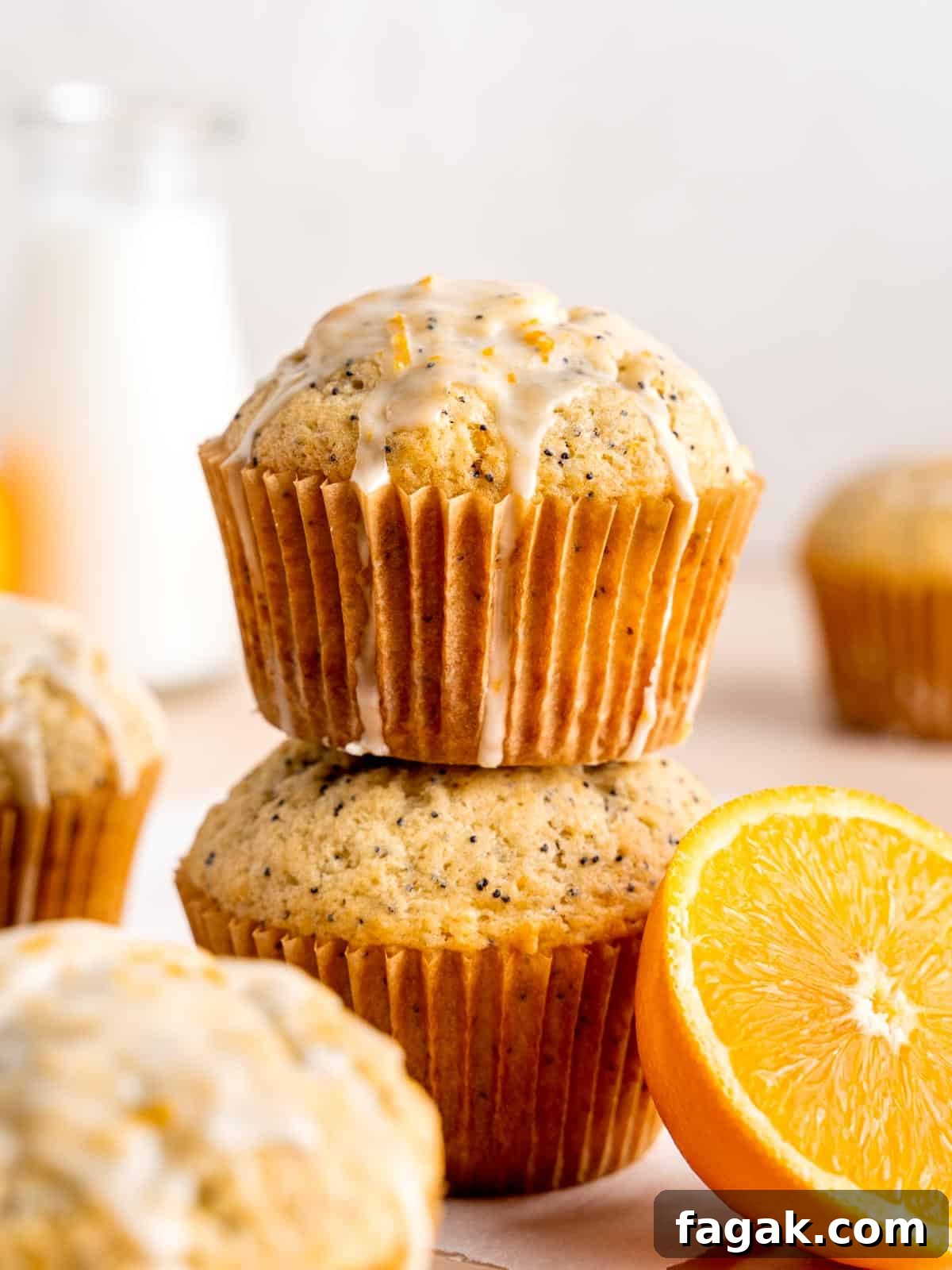 A stack of orange poppy seed muffins.