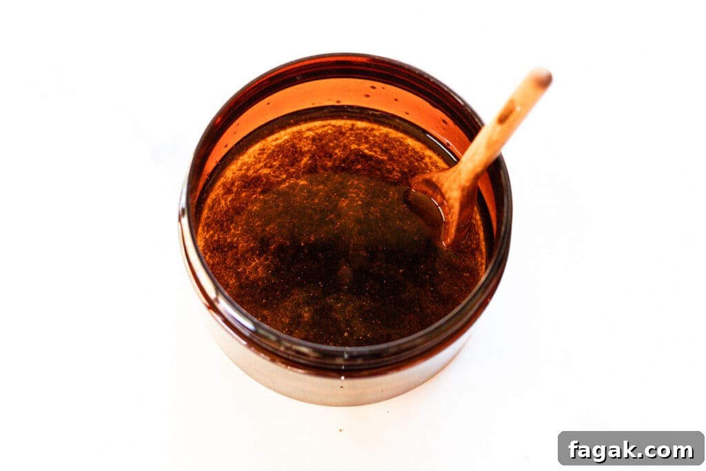 Stirring the foot mask ingredients in a small container.