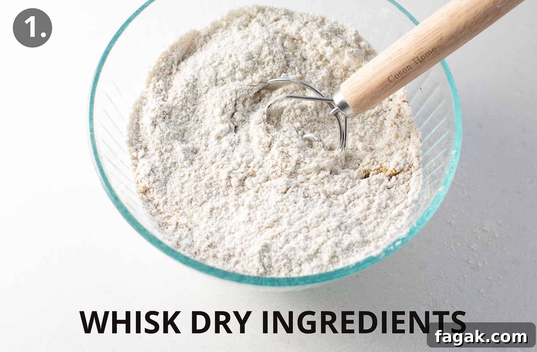 gingerbread cookie dry ingredients being whisked in glass bowl.