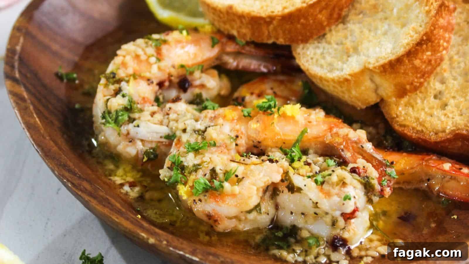 16 Light and Satisfying Shrimp Recipes for Quick Weeknight Meals 9 A plate with shrimp and bread on it.
