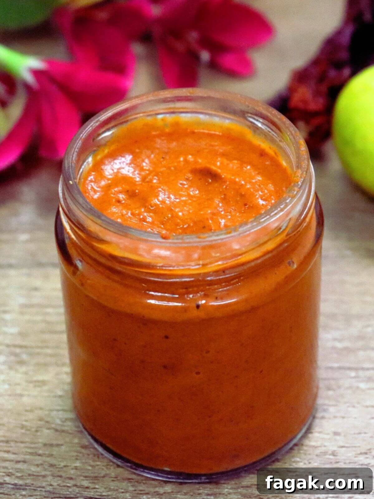 Homemade harissa paste in a glass jar.