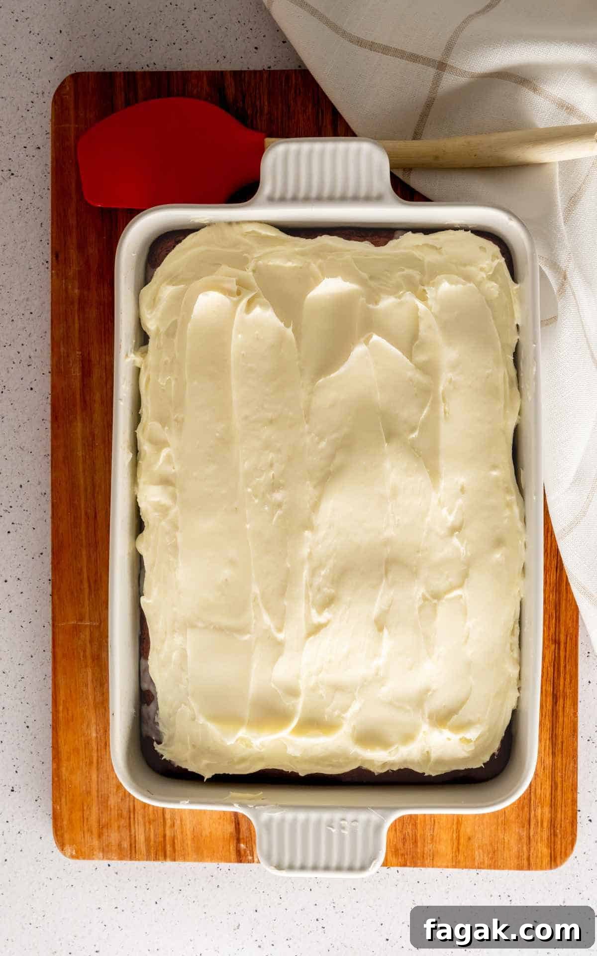 A 9x13 red velvet cake with homemade cream cheese frosting.