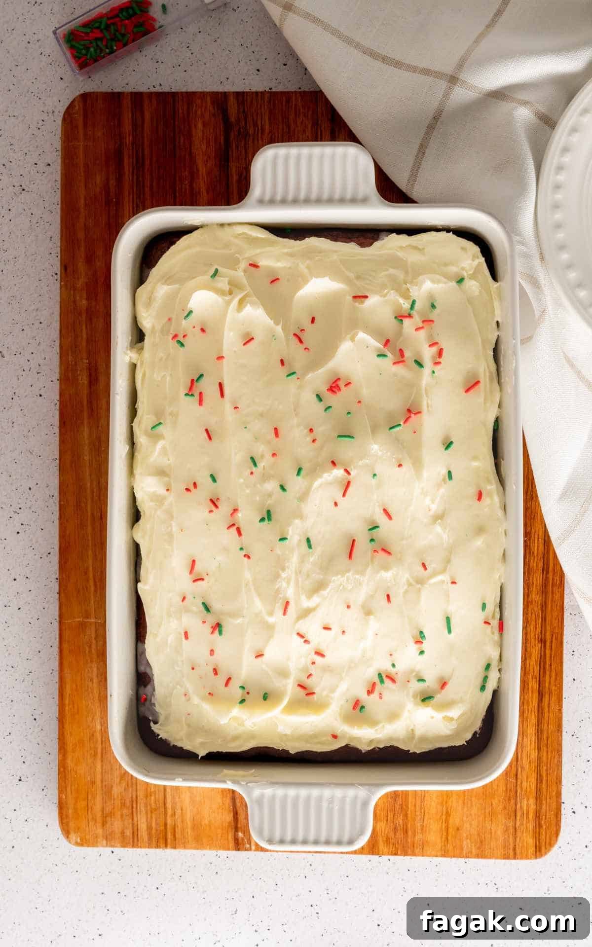 Red Velvet Cake decorated with red and green sprinkles.