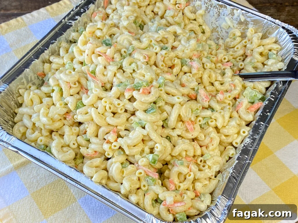 Overhead view of aluminum foil pan of macaroni salad for a crowd