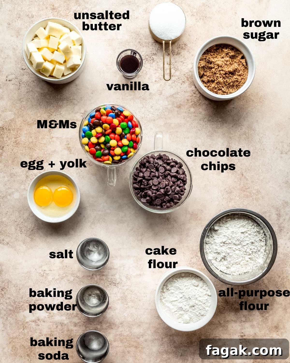 Ingredients shown are used to prepare M&M chocolate chip cookies.