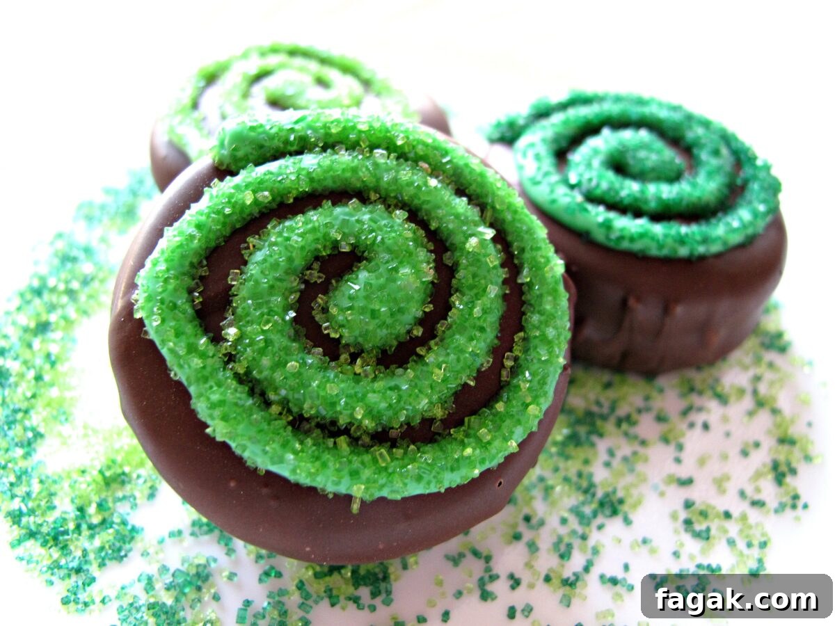 Closeup of swirl decorated chocolate coated cookies.