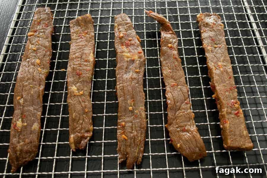 Chili lime jerky on dehydrator rack