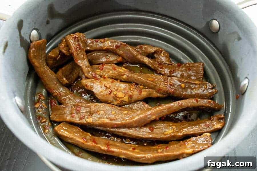 chili lime jerky strained in colander