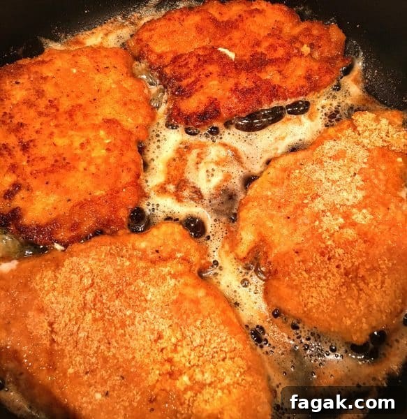 Buffalo Chicken Sandwich with Bleu Cheese and Crispy Ranch 4 Fried chicken breast in the skillet.