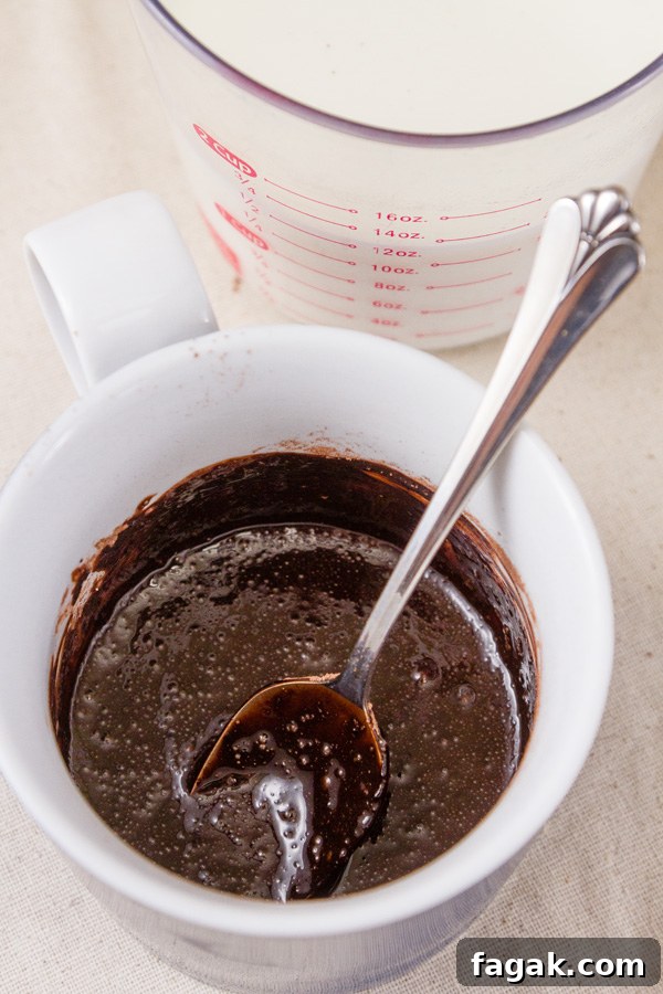 How to make Single Serving Hot Cocoa: Add a little bit of the milk and stir to make a paste. Be sure to get all the powder incorporated into the milk. 