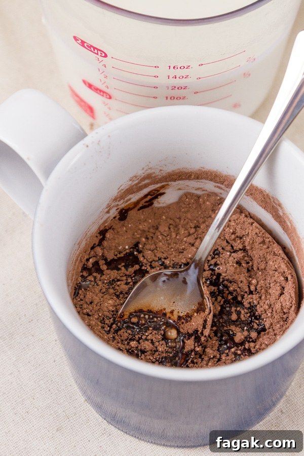 How to make Single Serving Hot Cocoa: Add a little bit of the milk and stir to make a paste. Be sure to get all the powder incorporated into the milk. 