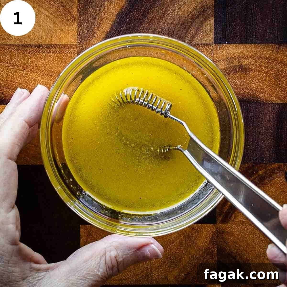 Whisking a salad dressing in a small bowl.