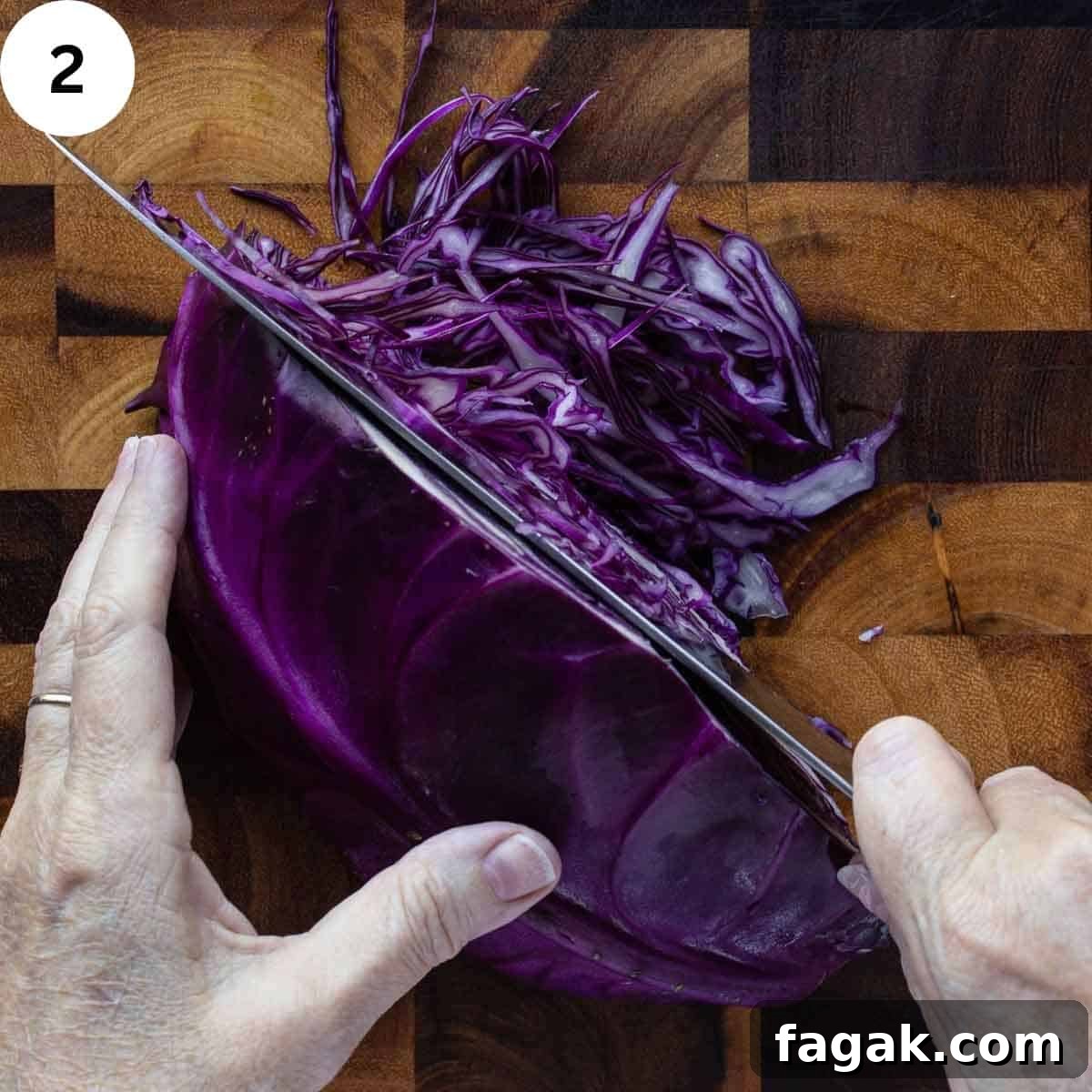 Slicing red cabbage very thinly.