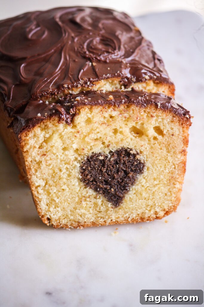 A buttery, mini loaf cake with vanilla cake on the outside and a surprise chocolate heart on the inside!