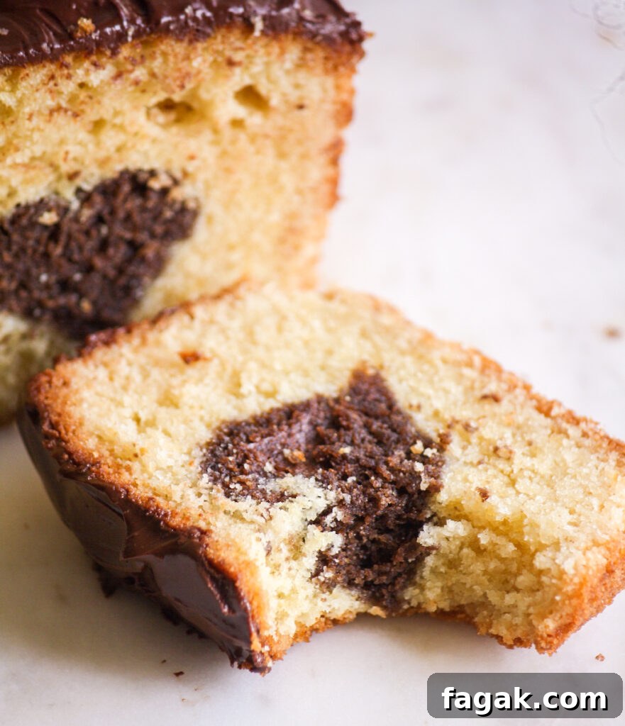 A buttery, mini loaf cake with vanilla cake on the outside and a surprise chocolate heart on the inside!
