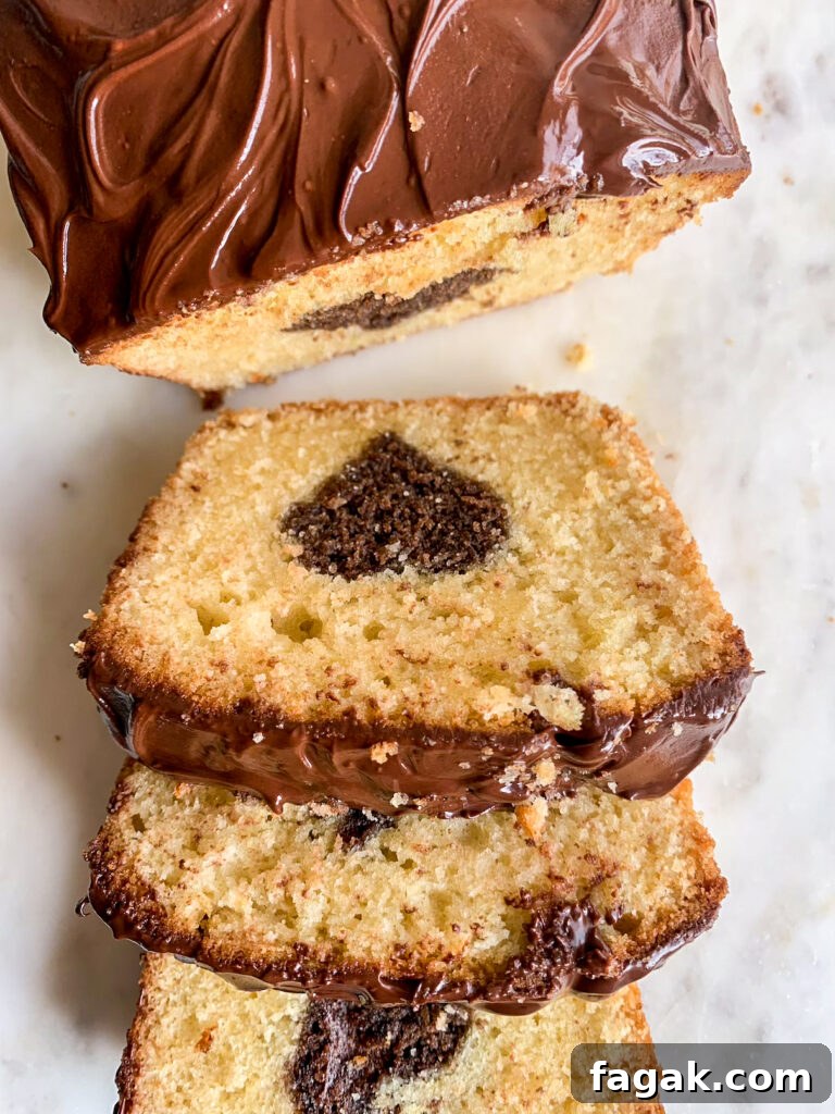A buttery, mini loaf cake with vanilla cake on the outside and a surprise chocolate heart on the inside!