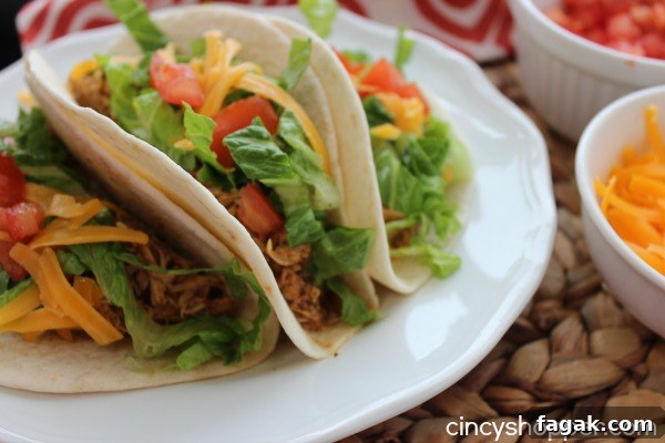 Slow Cooker Chicken Tacos - easy weeknight dinner idea. Loads of flavor.