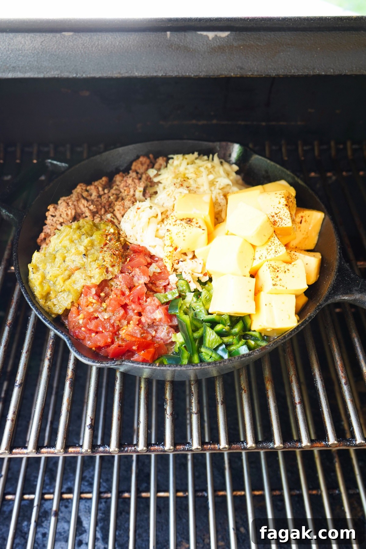 Queso in smoker before melted. Queso in smoker before melted.