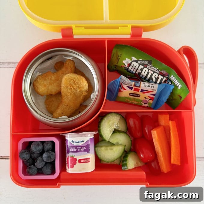 Chicken Nuggets served in a bright yellow Hot & Cold lunch box.