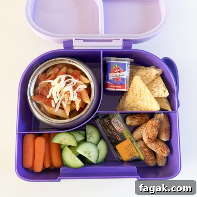 Cheese & Tomato pasta in a purple hot & cold lunch box.
