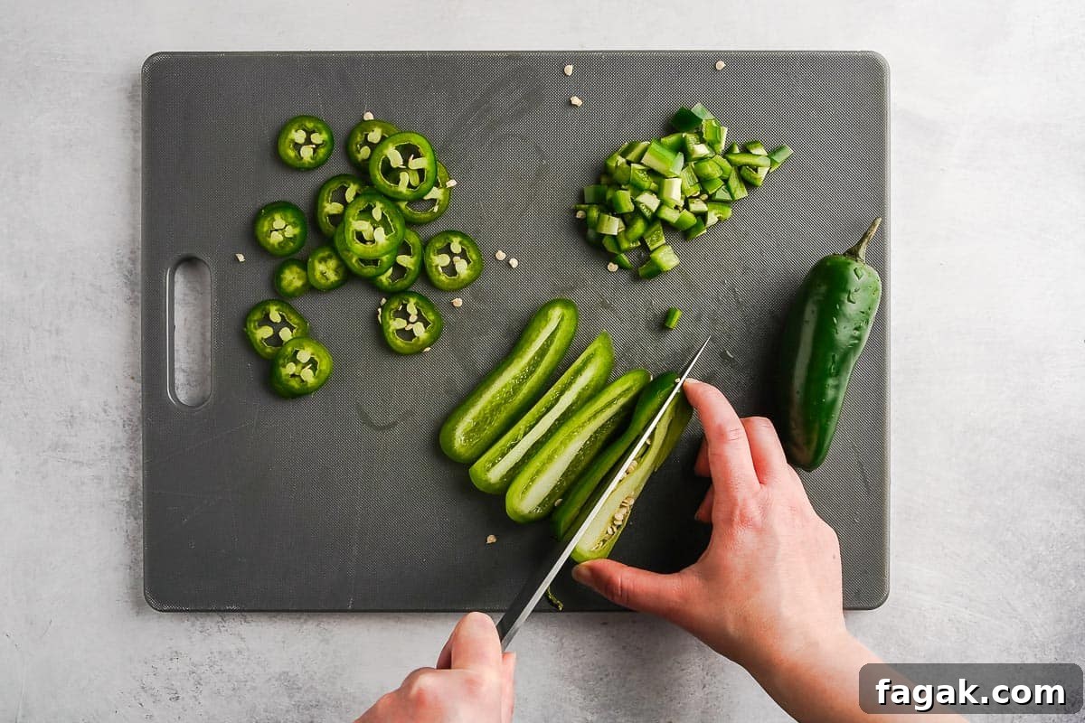 Knife Cutting Jalapeno on Cutting Board