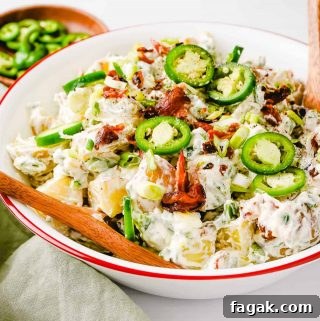 Jalapeno Popper Potato Salad in Bowl with Wooden Spoon