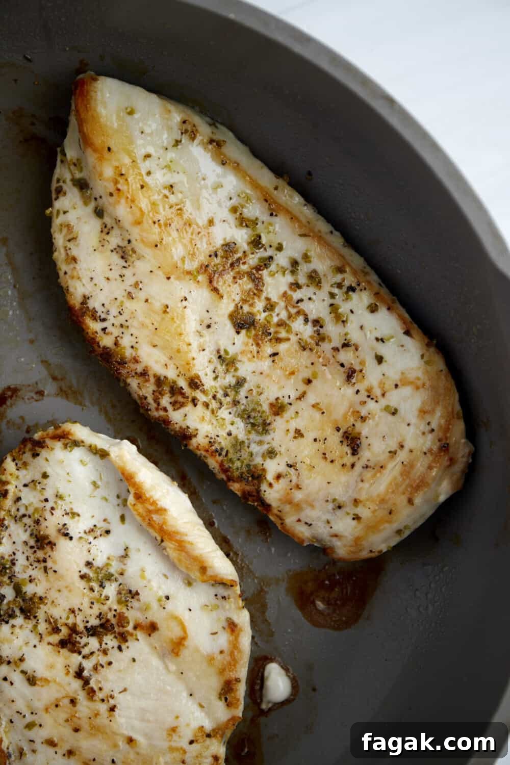 seasoned cooked chicken breasts in a skillet