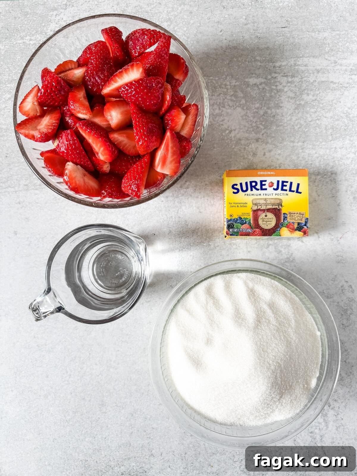 Hulled strawberries, sugar, pectin and water to make a freezer jam.