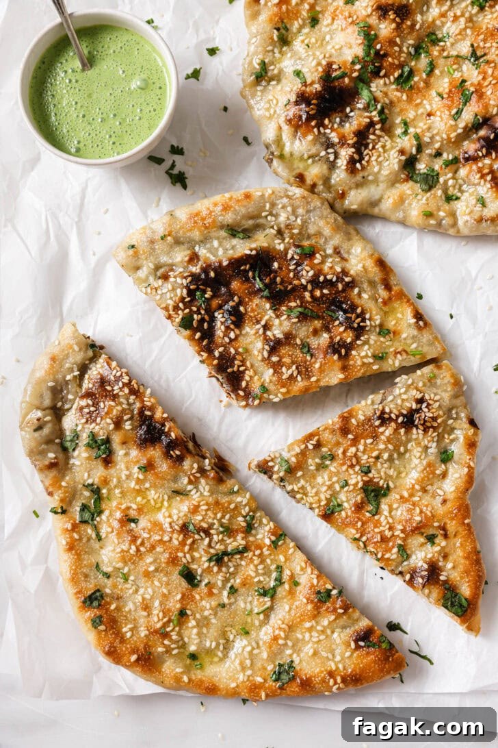 Foolproof Keema Naan Recipe: Step-by-Step Guide for Perfect Stuffed Bread 2 Keema Naan cut into pieces ready to be eaten.